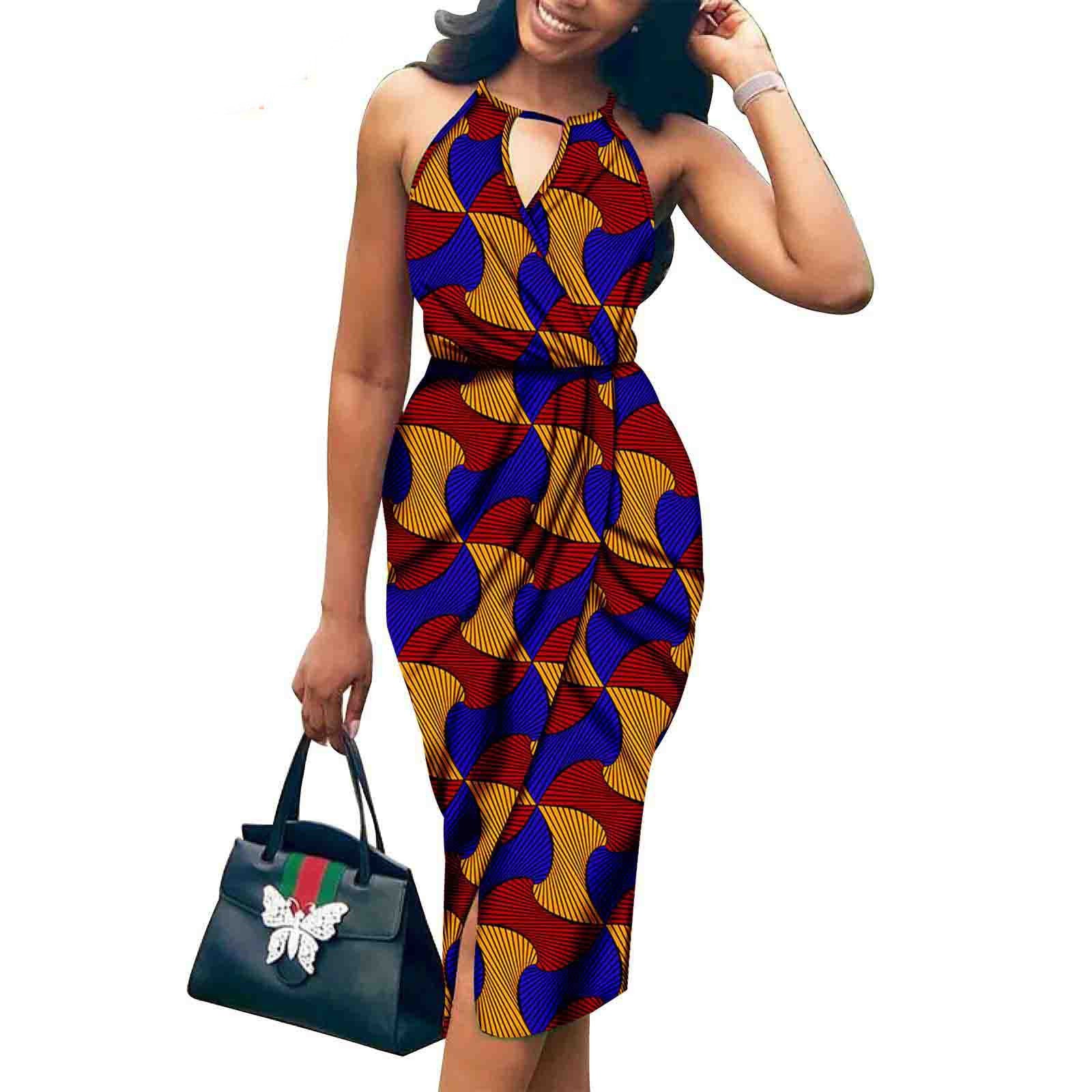 Woman wearing a colorful patterned dress holding a Gucci handbag on a white background