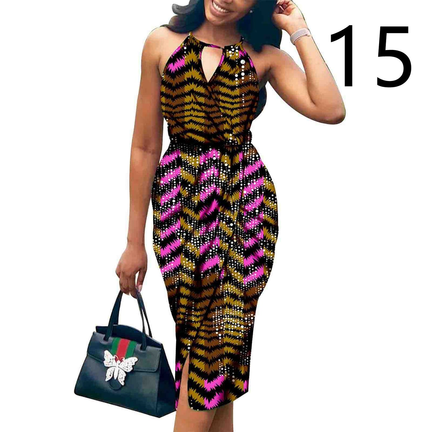 Woman wearing a colorful patterned dress holding a handbag on a white background