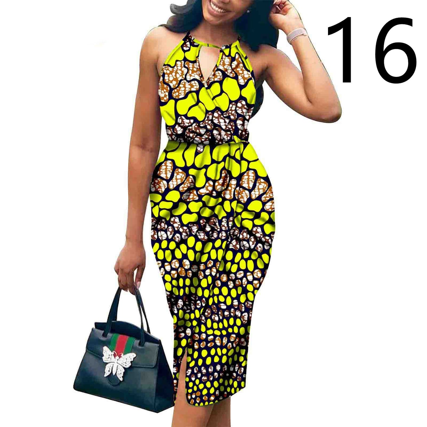 Woman wearing a colorful patterned dress holding a Gucci handbag on a white background