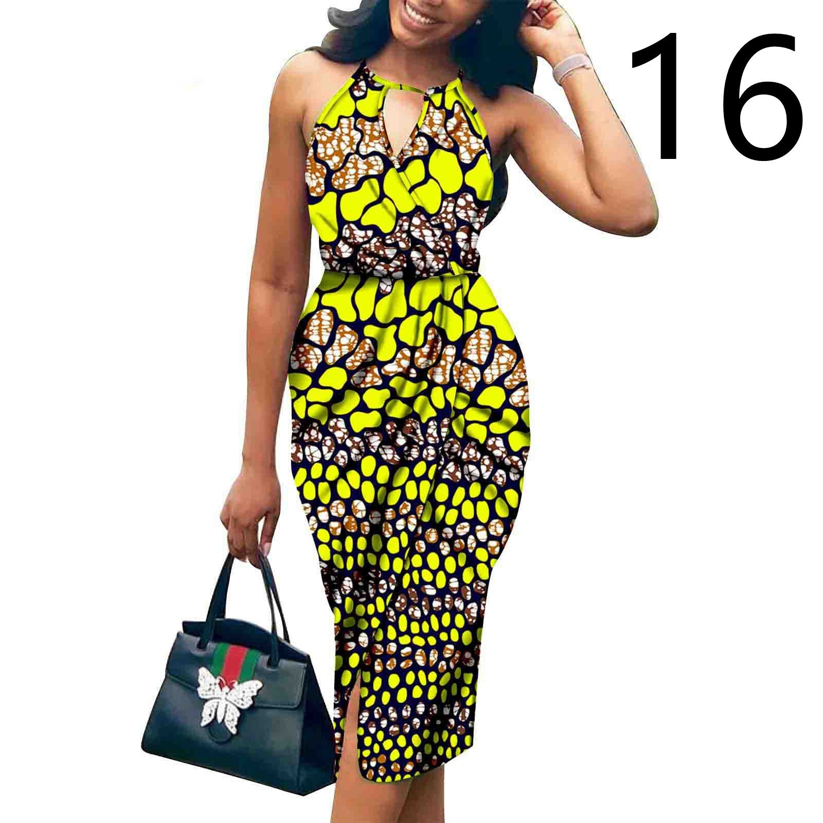 Woman wearing a colorful patterned dress holding a Gucci handbag on a white background