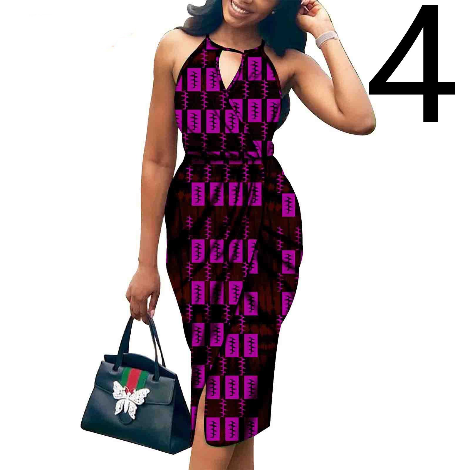 Woman wearing a black and purple patterned dress holding a black handbag with green and red accents.