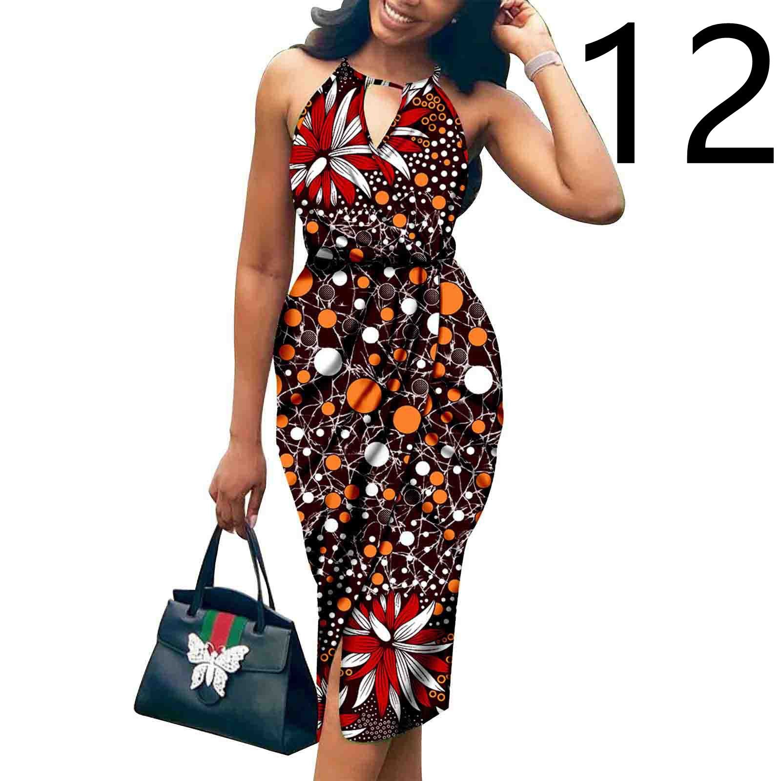Woman wearing a colorful patterned dress holding a handbag on a white background