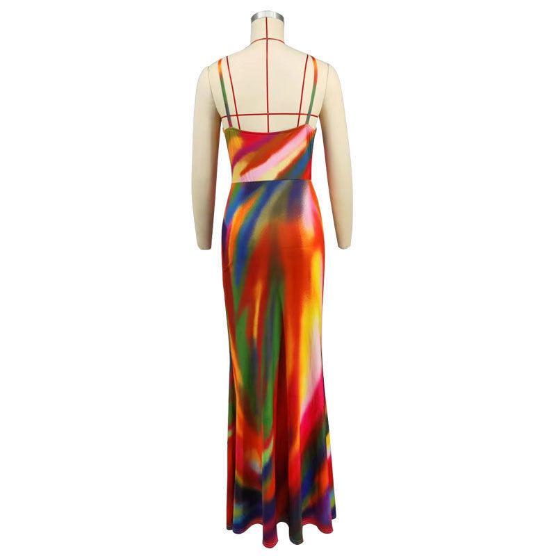 Mannequin wearing a colorful halter neck dress on a white background