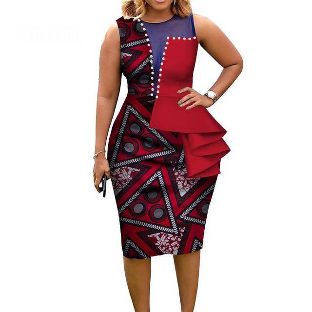 Woman wearing a red and black patterned dress on a white background
