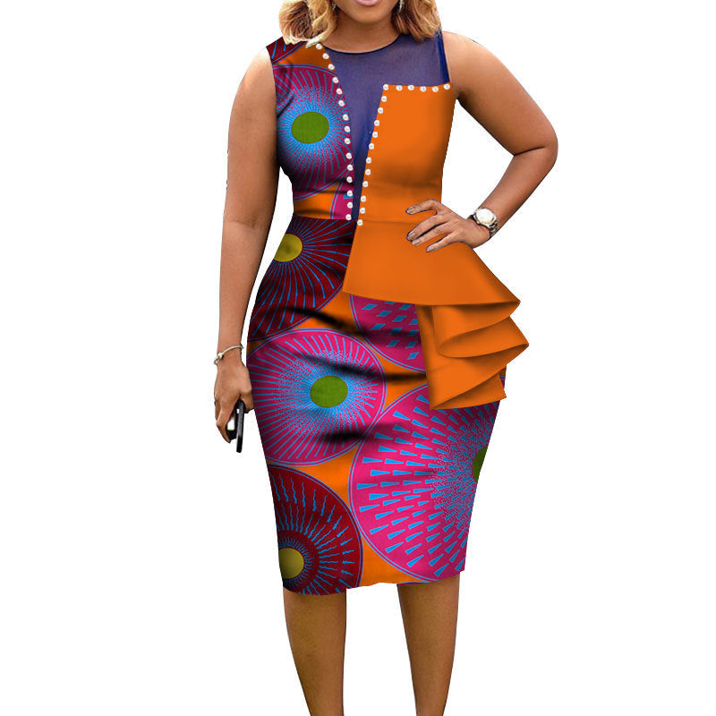 Woman wearing a colorful dress with geometric patterns on a white background