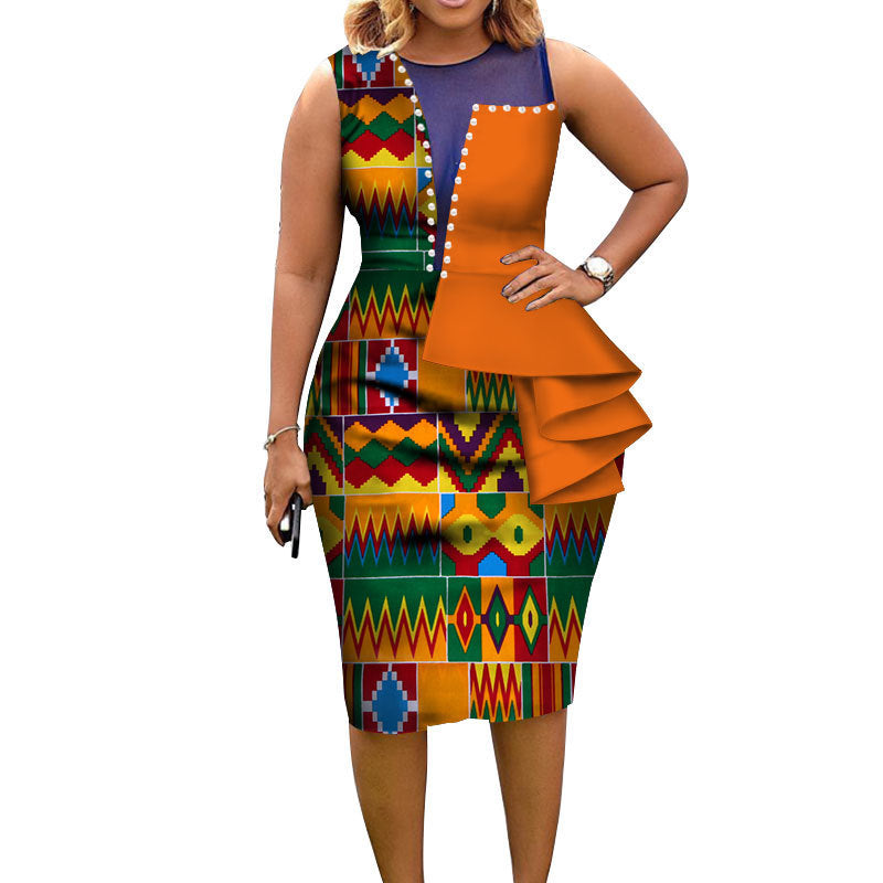Woman wearing a colorful patterned dress with an orange ruffled overlay on a white background