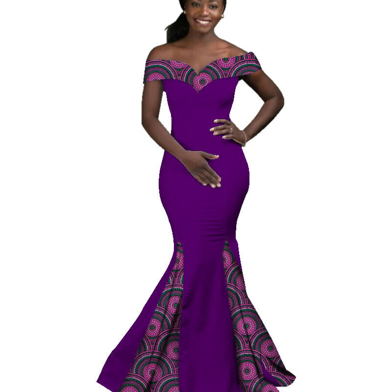 Purple evening gown with intricate patterns on a white background