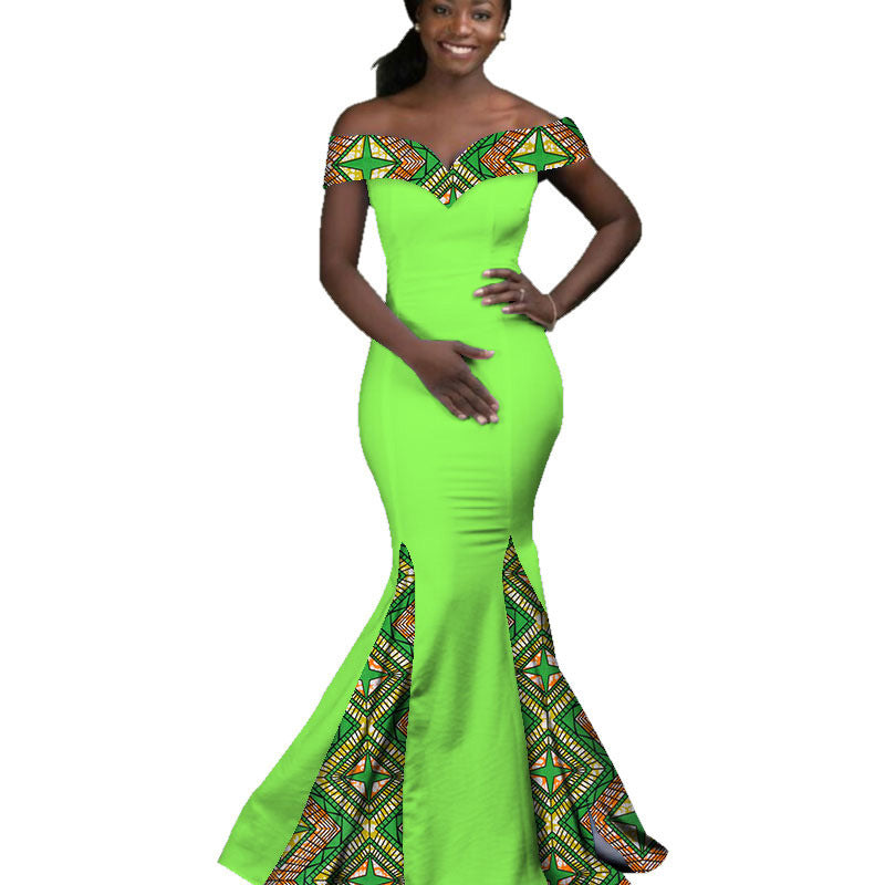 Woman wearing a bright green dress with patterned top and bottom sections on a white background