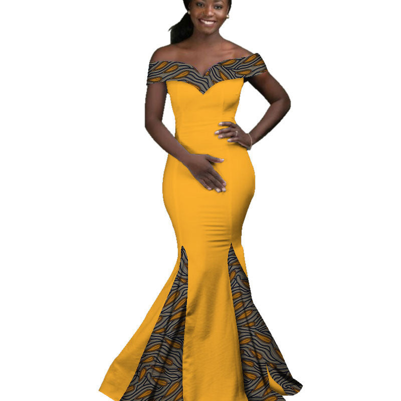 Woman wearing a yellow and black patterned off-shoulder dress on a white background