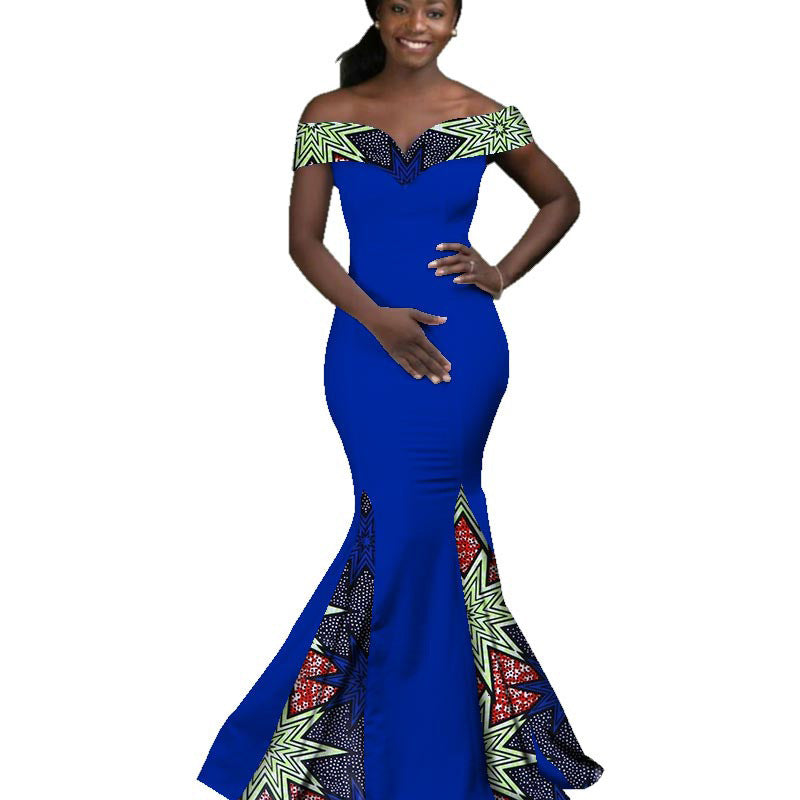 Blue evening gown with intricate patterns on a white background