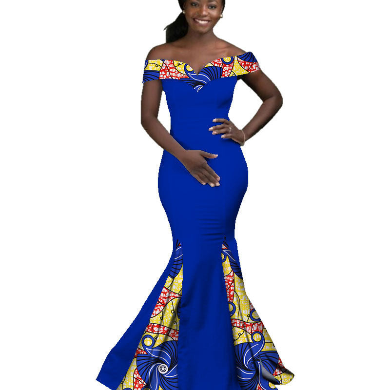 Woman wearing a blue and colorful off-shoulder dress on a white background