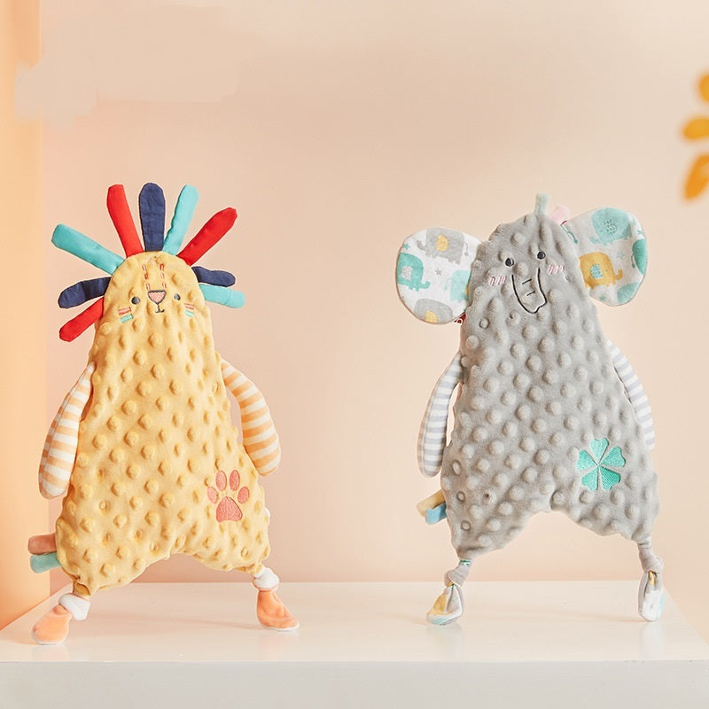 Two soft animal toys, one resembling a rooster and the other an elephant, on a light background.