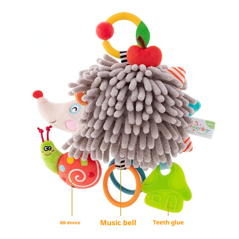 Hedgehog-shaped toy with colorful attachments on a white background