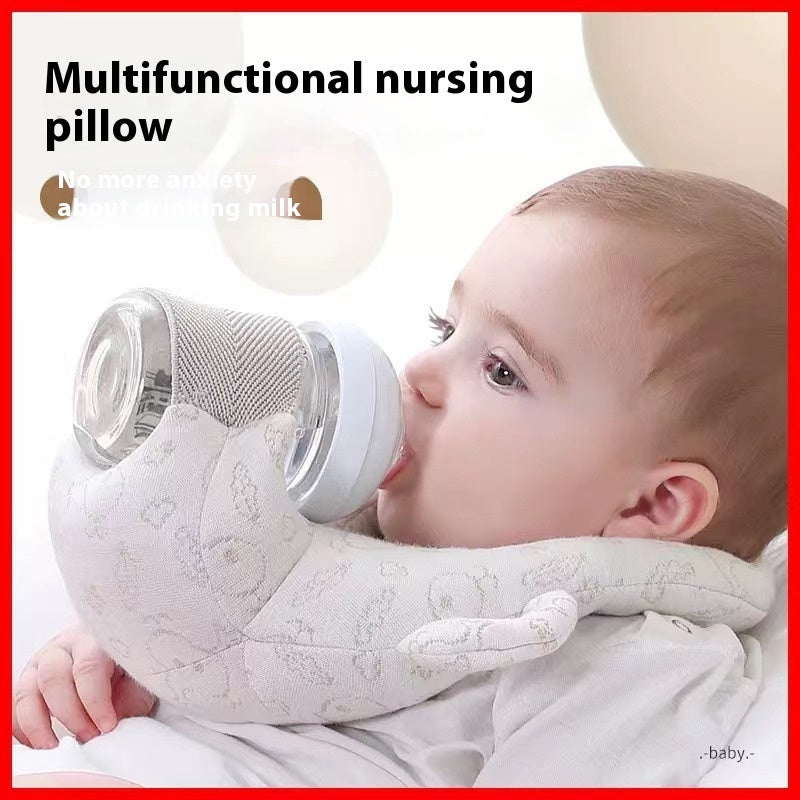 Baby using a multifunctional nursing pillow with a bottle