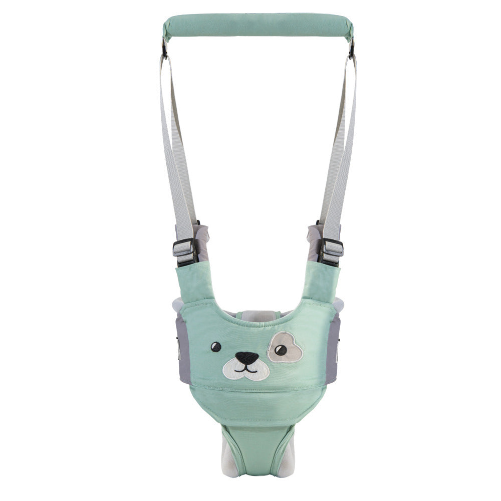 Mint green baby bouncer with a dog face design on a white background