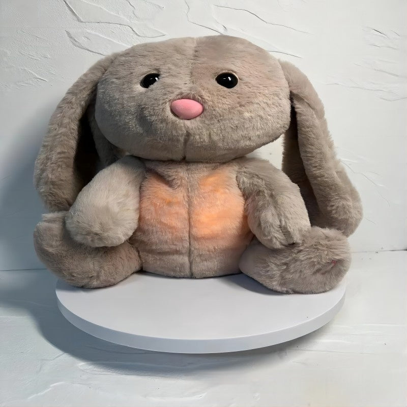 Plush toy rabbit on a white platform with a light gray background