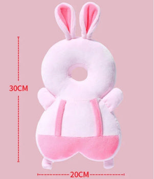 Plush toy with bunny ears and measurements on a pink background