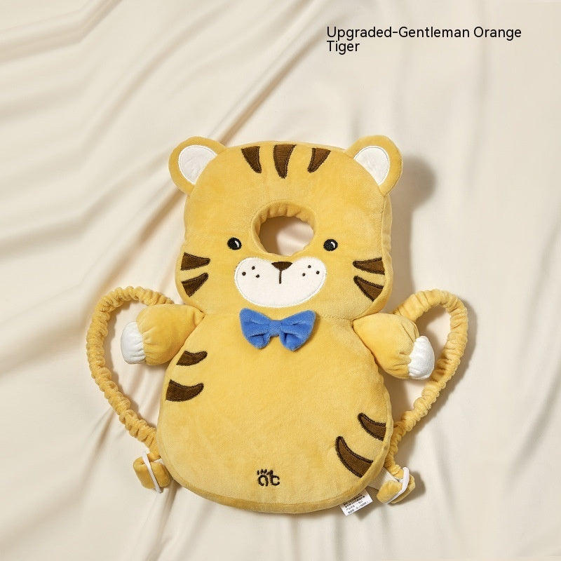Plush tiger toy with a blue bow tie on a beige background