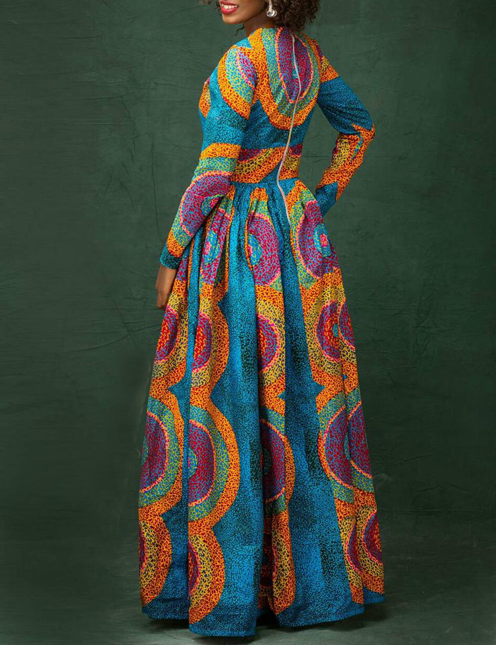 Colorful patterned dress with a green background