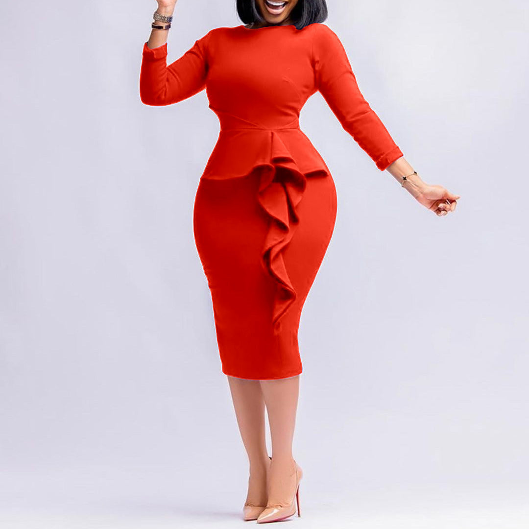 Red dress with ruffled details on a white background