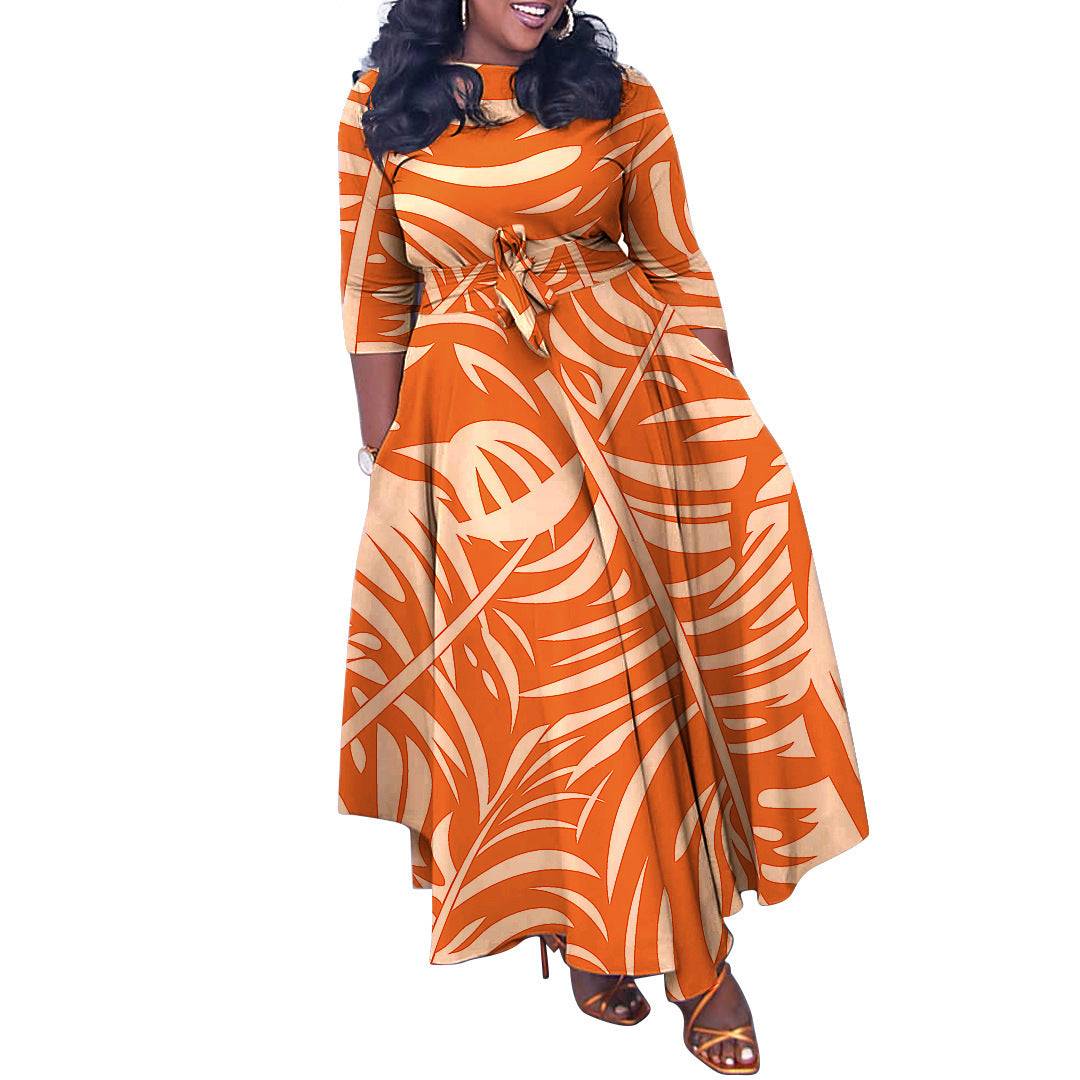 Woman wearing an orange and white patterned dress on a white background