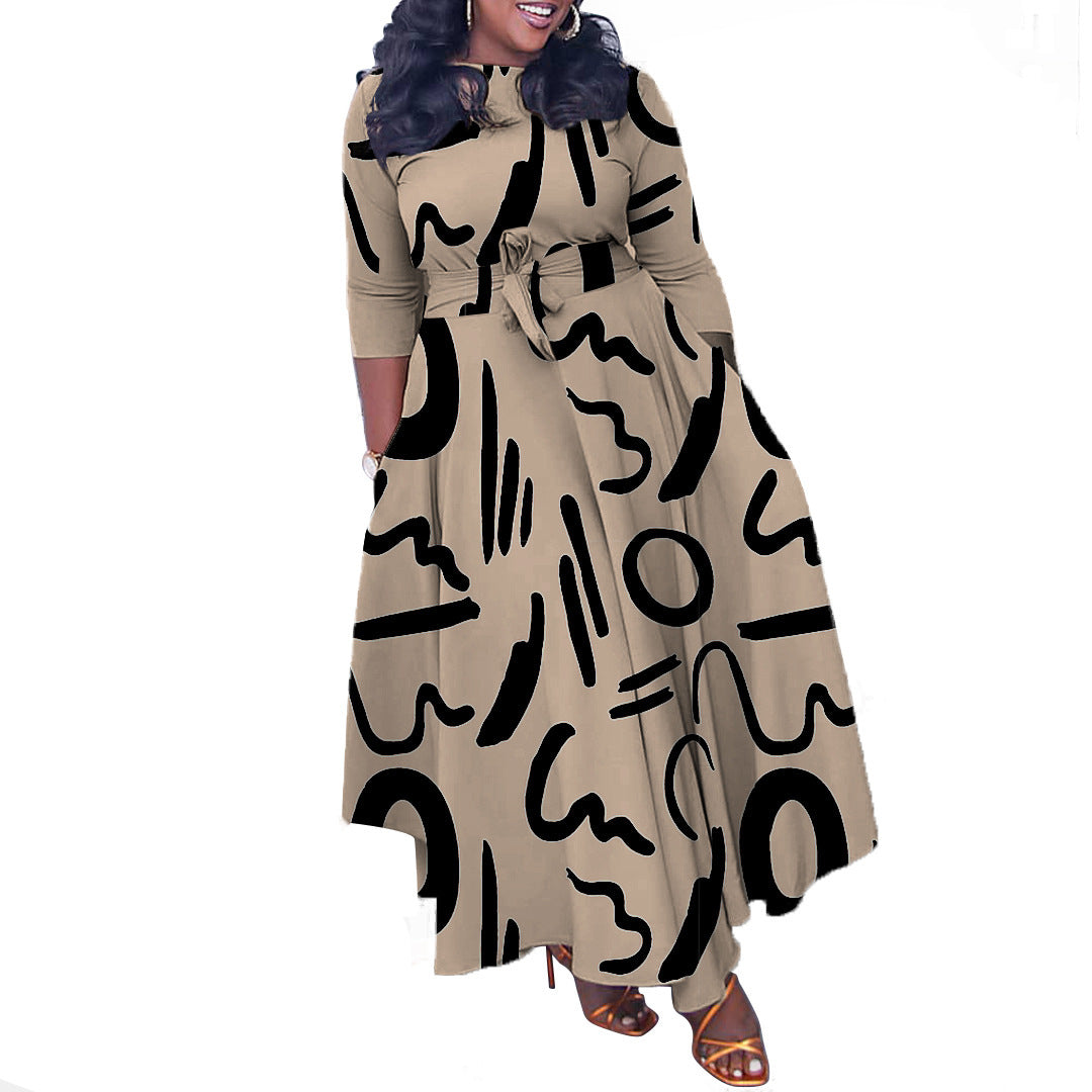 Beige dress with black abstract patterns on a white background