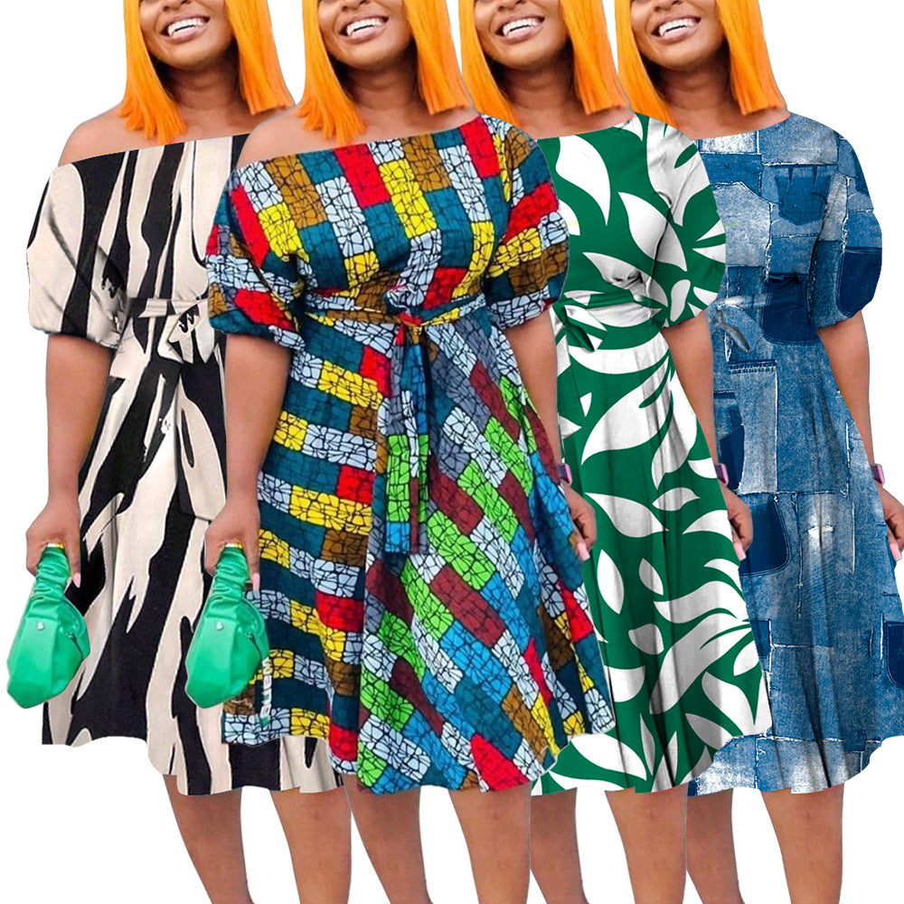 Four women wearing colorful dresses with different patterns on a white background