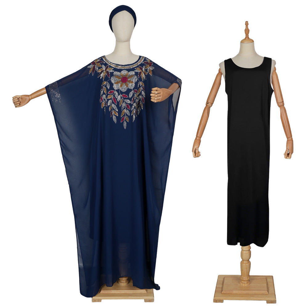 Navy blue dress with floral embroidery on a mannequin and a black sleeveless dress on another mannequin against a white background.