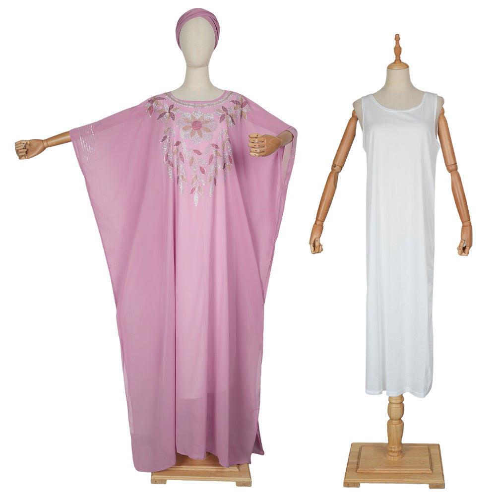 Pink and white dresses on mannequins against a white background