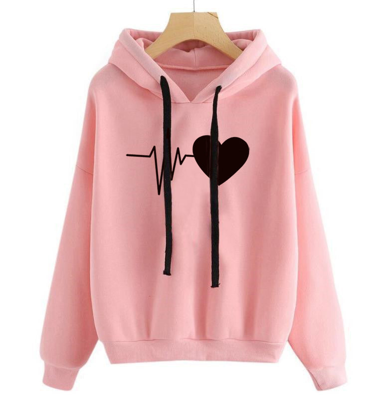 Pink hoodie with a black heart and heartbeat line design on a white background