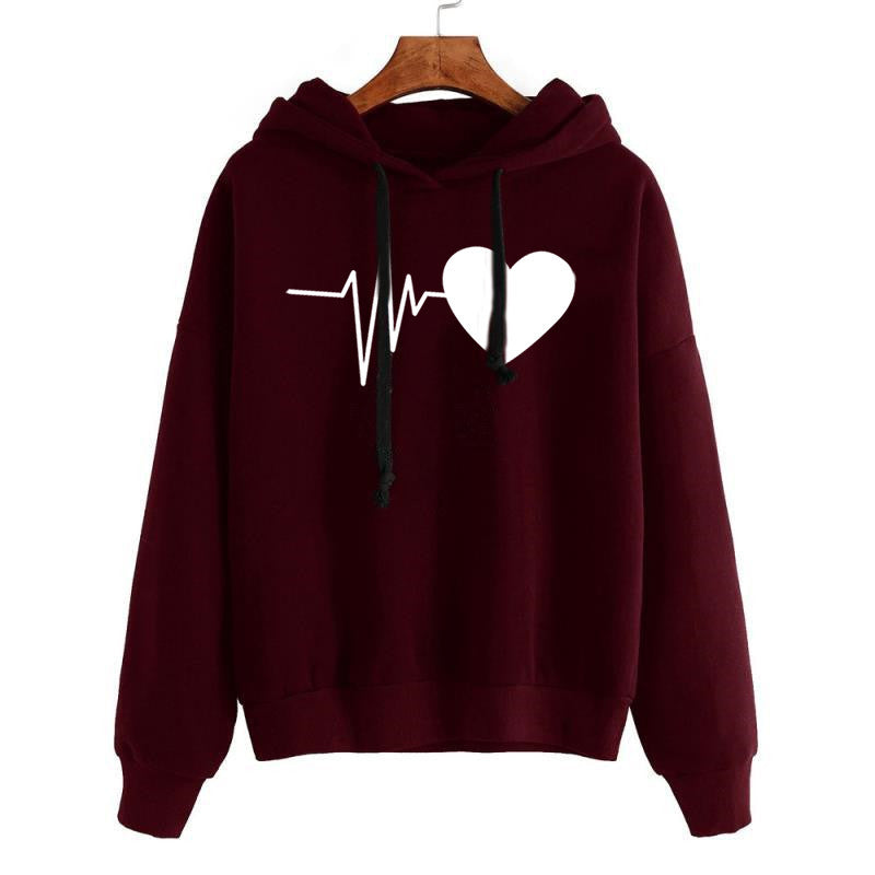 Maroon hoodie with a white heart and line design on a hanger against a white background