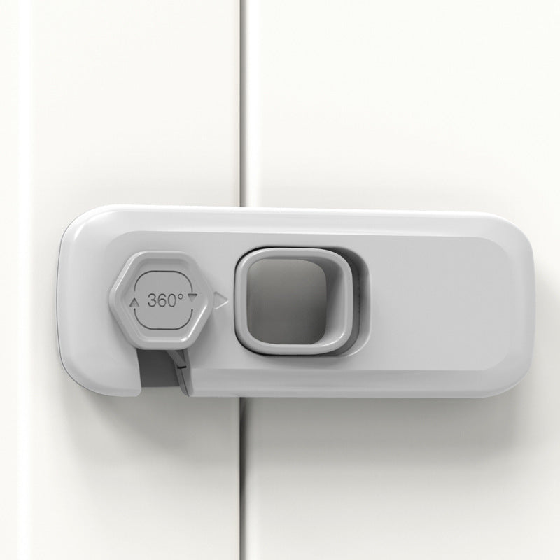 White door handle with a 360-degree rotation indicator on a white tiled background