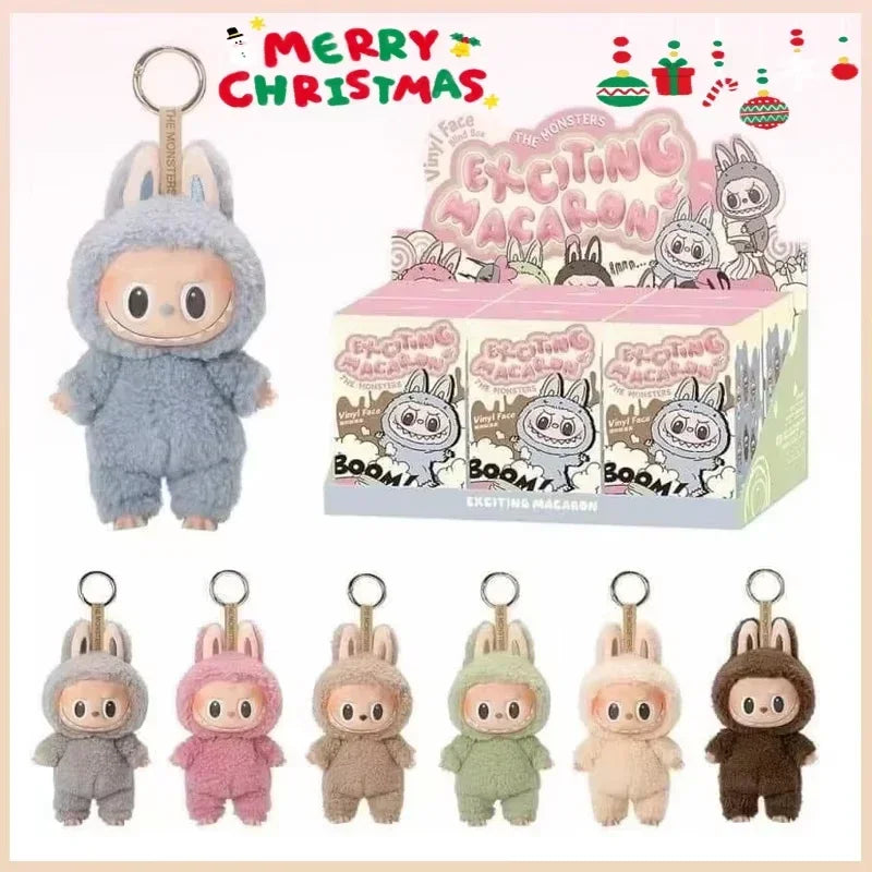 Plush keychain figures in various colors with packaging and 'Merry Christmas' text.
