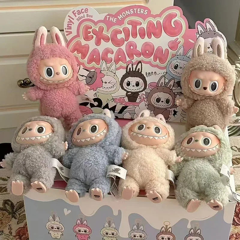 Collection of plush toys with a 'Vinyl Face' blind box in the background