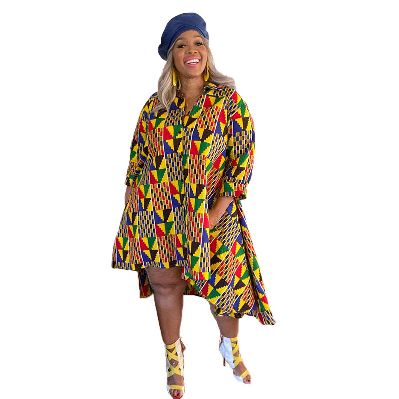 Woman wearing a colorful patterned dress and hat on a white background