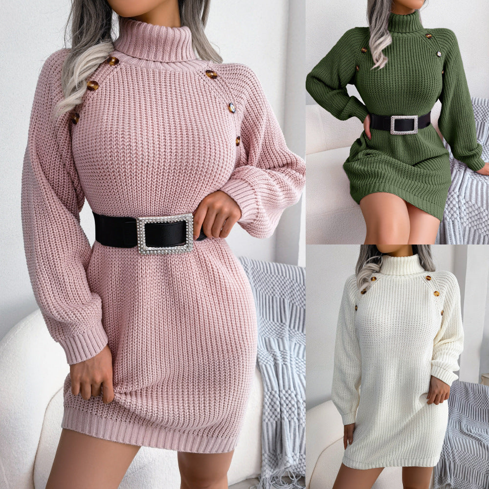Three knitted dresses in pink, green, and white with button details on a neutral background.