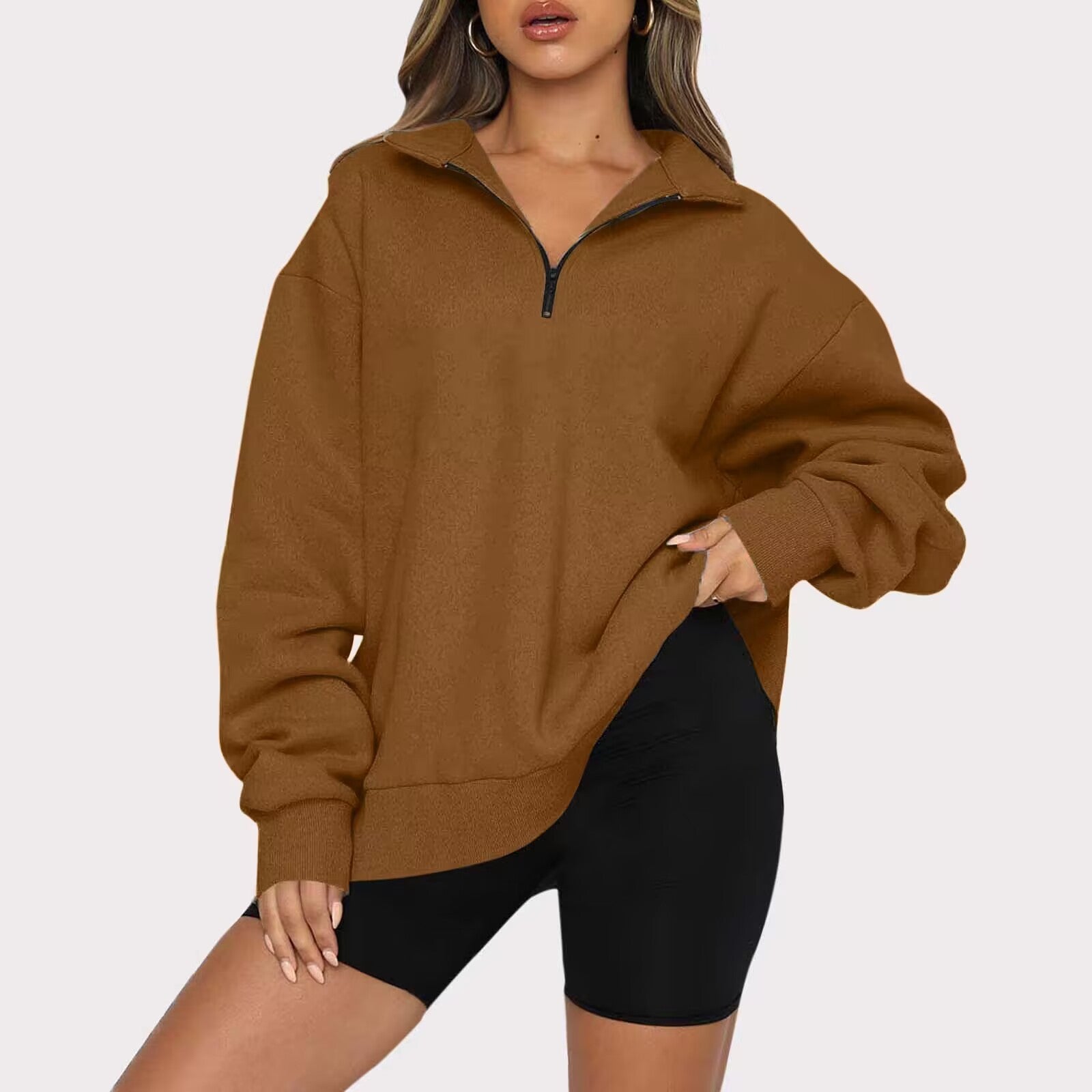 Brown zip-up sweatshirt worn by a person on a white background