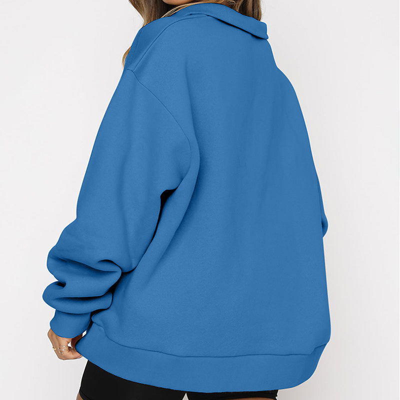 Blue sweatshirt worn by a person on a white background