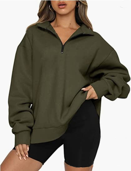 Person wearing a green pullover with a zipper on a white background