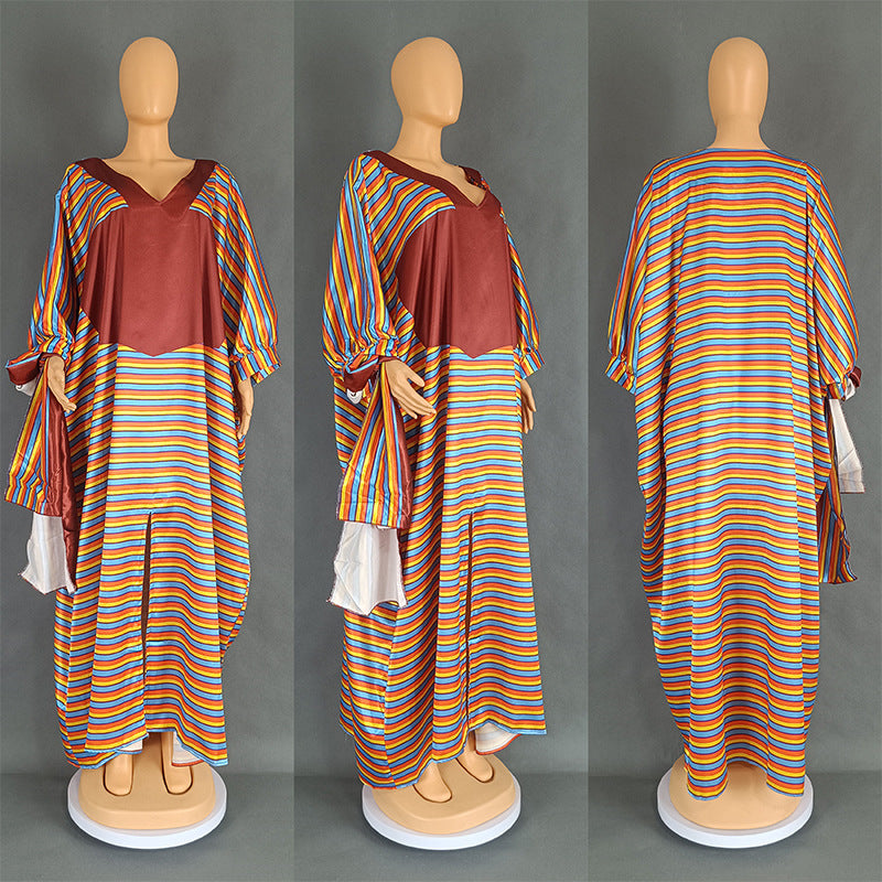 Multicolored striped dress on a mannequin against a gray background