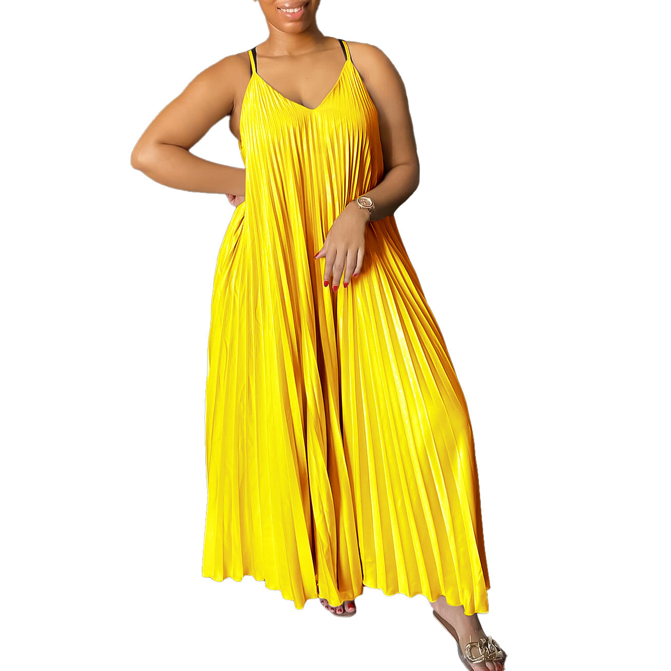 Woman wearing a yellow pleated dress on a white background