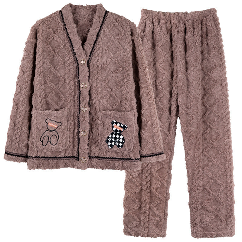 Brown fleece pajama set with teddy bear designs on a white background