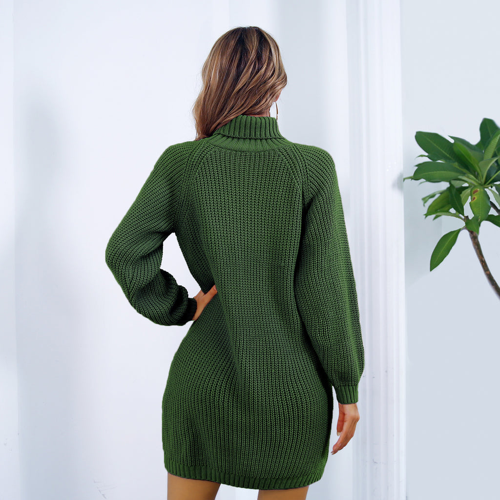 Green knitted dress worn by a person against a white background