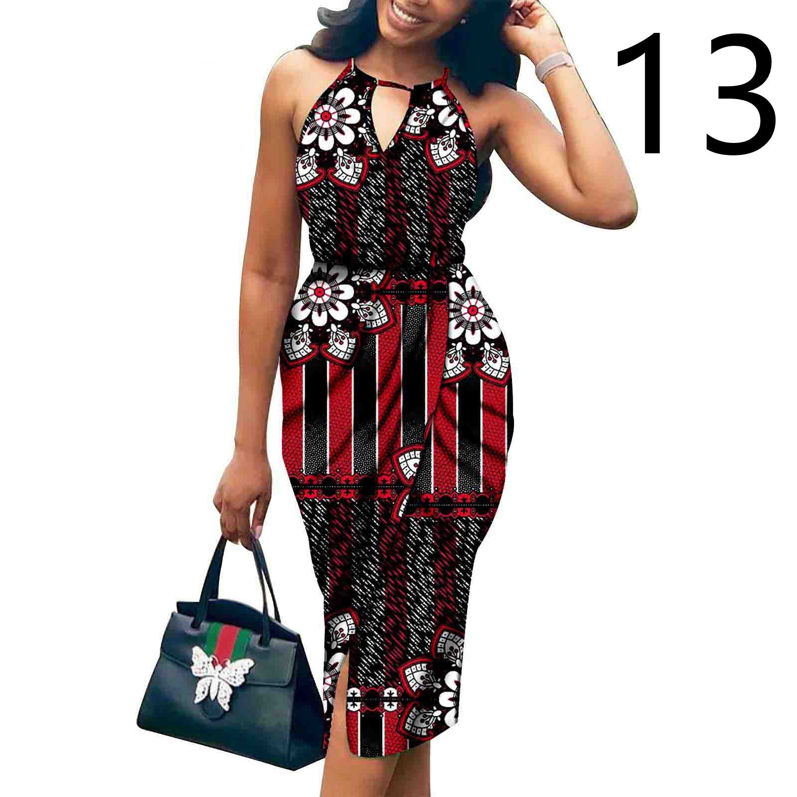 Woman wearing a red and black patterned dress holding a green handbag on a white background.