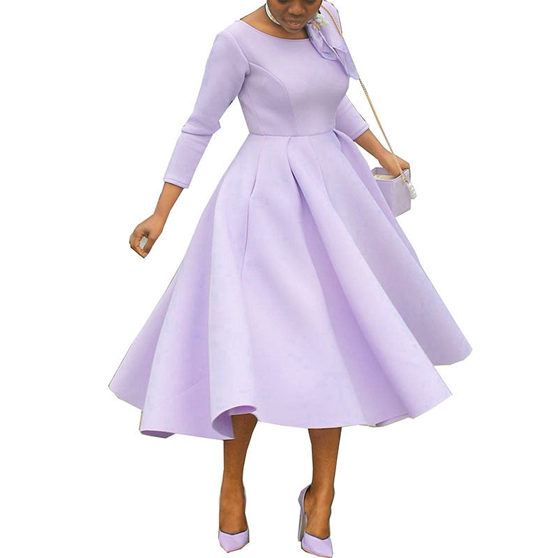 Woman wearing a light purple dress with a white background