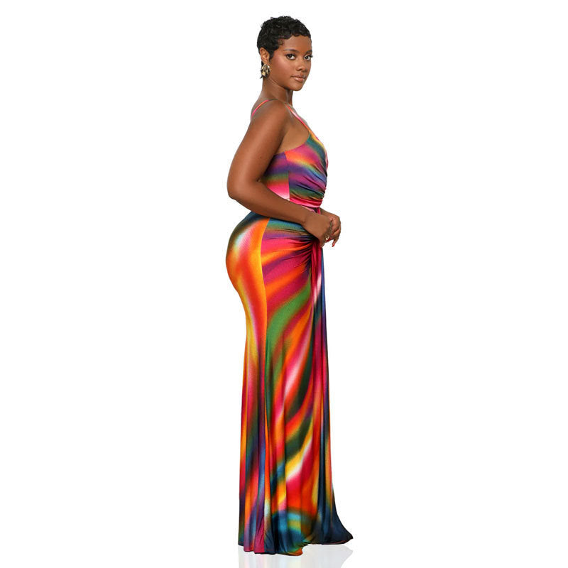 Woman wearing a colorful strapless gown on a white background