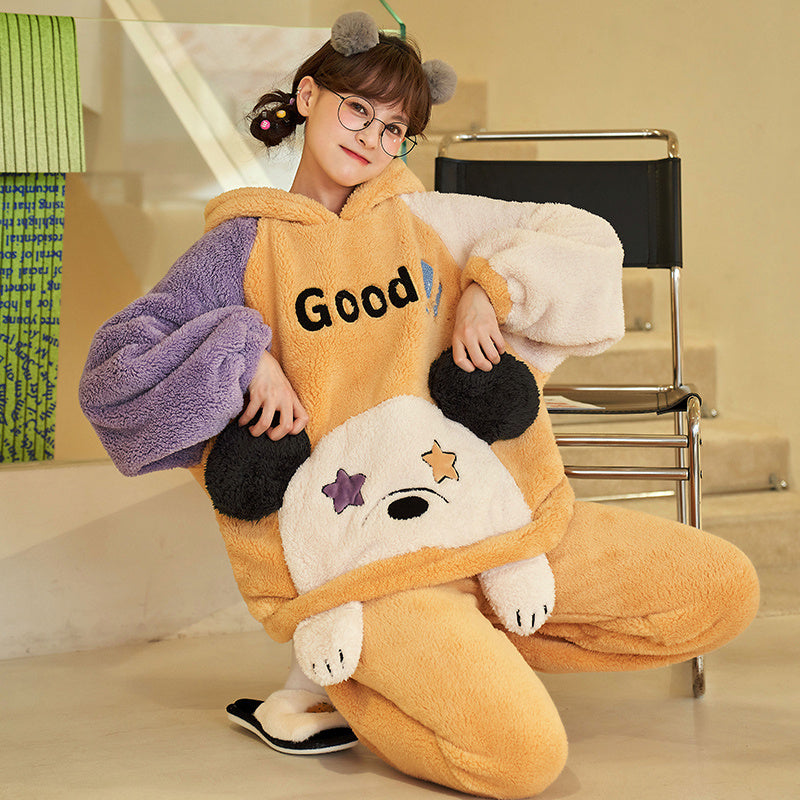 Person wearing a large, plush, cartoon-like outfit with a bear design and 'Good' text.