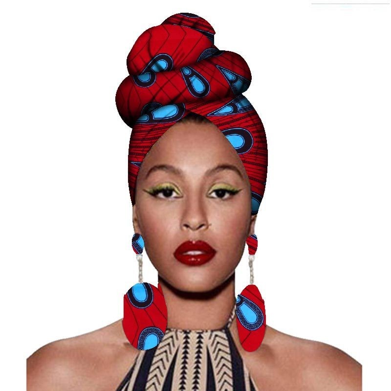 Woman wearing a red and blue headscarf and earrings on a white background