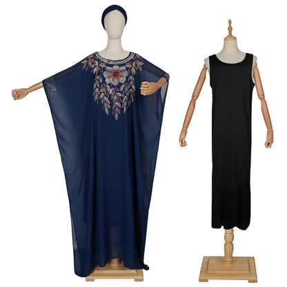 Navy blue dress with floral embroidery on a mannequin and a black sleeveless dress on another mannequin against a white background.