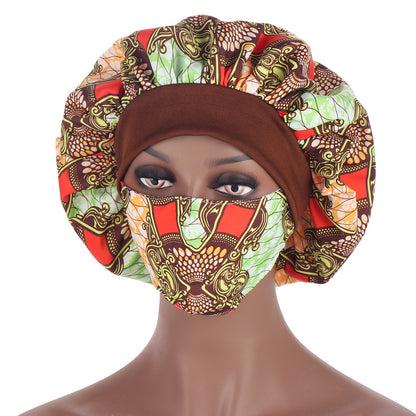 Mannequin head wearing a colorful patterned headscarf and face mask on a white background